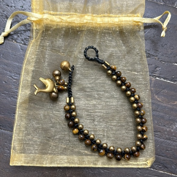 Brown and bronze colored beaded dolphin bracelet. - Picture 1 of 5
